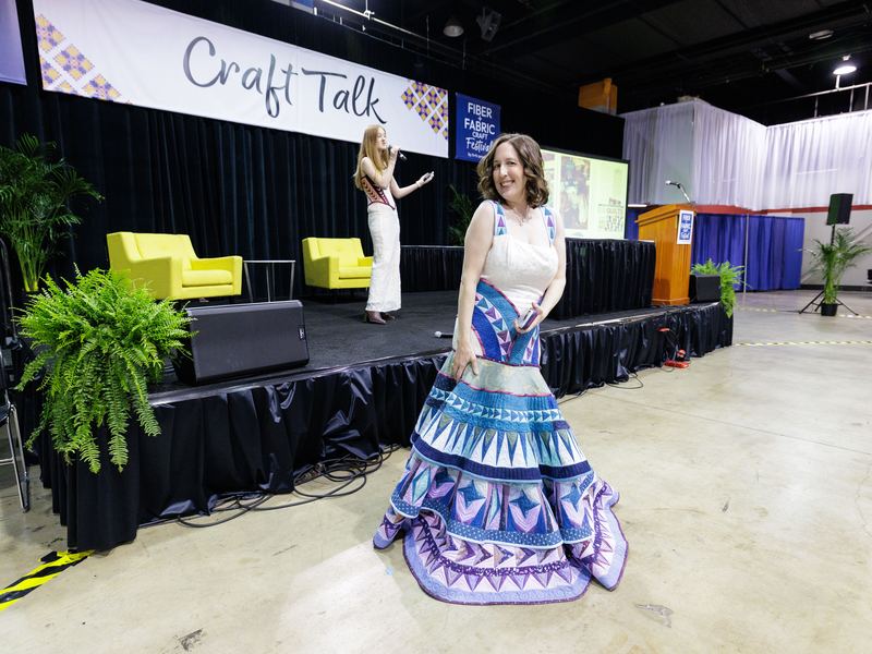 A garment on display in a curated festival exhibit