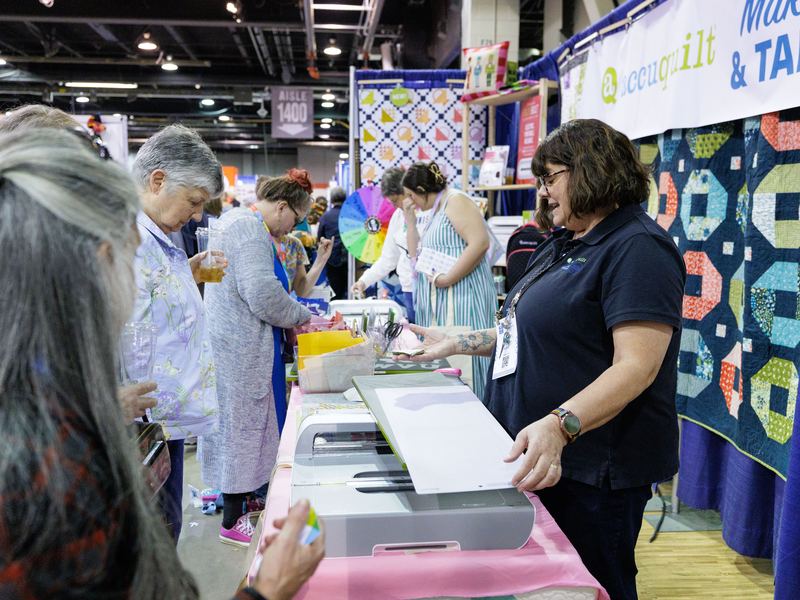 Makers working together at a table during a hands-on session